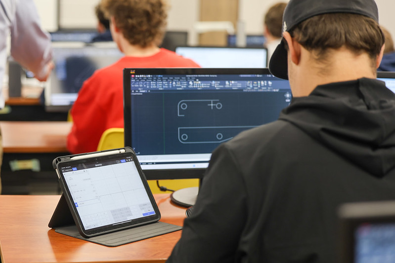 Photo of a student working at a computer